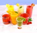 Fruit juices, kiwi, raspberries, cherry, orange, strawberry, pineapple Royalty Free Stock Photo