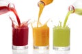 Fruit juices poured from bottles Kiwi, currants, orange Royalty Free Stock Photo