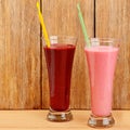 Fruit juices and smoothies made from strawberries, currants, raspberries on a wooden Royalty Free Stock Photo