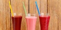 Fruit juices and smoothies on a wooden background. Wide photo Royalty Free Stock Photo