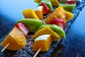 Fruit Kebab made of Oranges, Strawberries, Kiwi, Mango. Selective focus Royalty Free Stock Photo