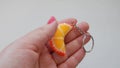 Fruit keychain in a female hand