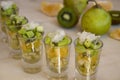 Fruit, kiwi, orange and pear in small cups