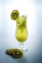 Fruit lemonade in hurricane glass with kiwi and lemon Royalty Free Stock Photo