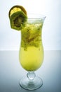 Fruit lemonade in hurricane glass with kiwi and lemon Royalty Free Stock Photo