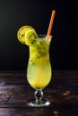 Fruit lemonade in hurricane glass with kiwi and lemon Royalty Free Stock Photo