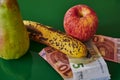 Fruit lying together with European banknotes