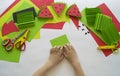 Fruit made of craft paper. Children`s hands