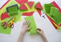 Fruit made of craft paper. Children`s hands