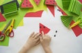 Fruit made of craft paper. Children`s hands