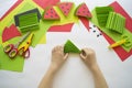 Fruit made of craft paper. Children`s hands