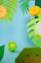 Fruit made of paper. Blue background. Tropics