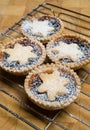 Fruit mince tarts for christmas day on cooling rack and chopping board