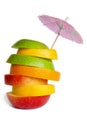 Fruit mix. red apple, green apple, orange, lemon, grapefruit. cocktail umbrella. fruit slicing. Royalty Free Stock Photo