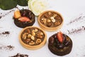 Fruit and nut cakes with white rose on background, romantic dessert. High angle view, color image and macro