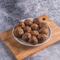 Fruit and nut energy balls in a plate, top view