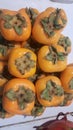 Fruit of orange persimmons for sale