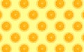 Fruit pattern of fresh orange halves on yellow background Royalty Free Stock Photo