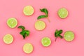 Fruit pattern. Lime round slices composition on pink background top view