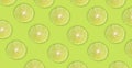 Fruit pattern of lime slices isolated on green background Royalty Free Stock Photo