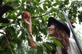 Fruit picking girl at outer place Royalty Free Stock Photo
