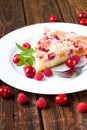 Fruit pie on white plate with berries Royalty Free Stock Photo