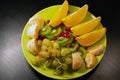 Fruit plate on a black background Royalty Free Stock Photo