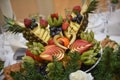 Fruit plate with chopped fruits and berries