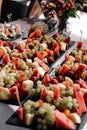 Fruit plate. Dessert watermelon, strawberry, grapes, melon, apricot on a mica board on a table on a light background Royalty Free Stock Photo