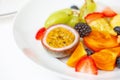 Fruit plate of fresh fruit slices for breakfast. On a white plate, passionfruit Royalty Free Stock Photo