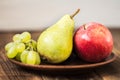 Fruit plate grapes apple plum pear Royalty Free Stock Photo