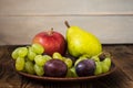 Fruit plate grapes apple plum pear Royalty Free Stock Photo