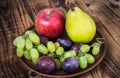 Fruit plate grapes apple plum pear Royalty Free Stock Photo