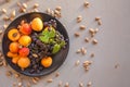 Fruit plate with grapes, apricot and almond on black plate Royalty Free Stock Photo