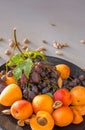 Fruit plate with grapes, apricot and almond.