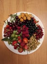Fruit plate - strawberry, cherry, currant, gooseberry, raspberry