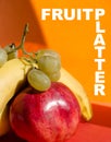 FRUIT PLATTER: golden apple, banana, pomegranate and grapes Royalty Free Stock Photo