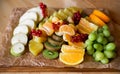 Fruit platter with kiwi, apple, red currant, grapes and oranges Royalty Free Stock Photo