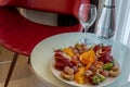 Fruit Platter on table with red chair Royalty Free Stock Photo