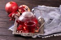 Fruit pomegranate tea in a teapot and cup