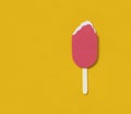 Fruit popsicle with couple of bites on yellow background. Flat lay, top view. Minimalist concept with copy space. Paper ice-cream