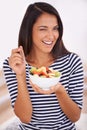 Fruit, portrait and wink with healthy eating woman, bowl and happy for fresh food. Natural, nutrition and sustainable Royalty Free Stock Photo