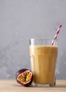 Fruit protein shake on a wooden table. Fresh milkshake with passion fruit. A glass of protein shake Royalty Free Stock Photo