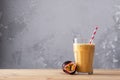 Fruit protein shake on a wooden table. Fresh milkshake with passion fruit. A glass of protein shake Royalty Free Stock Photo
