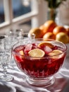 Fruit punch bowl with ice and citrus slices on a table. Royalty Free Stock Photo
