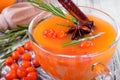 Fruit punch with sea buckthorn berries, citrus and spices in a glass cup