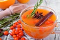 Fruit punch with sea buckthorn berries, citrus and spices in a glass cup