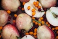 Fruit punch with sliced half apples and buckthorn berries macro