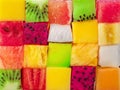 Fruit puzzle. Colorful food background or pattern arranged of different fruit cubes. Dietary concept Royalty Free Stock Photo