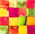 Fruit puzzle. Colorful food background or pattern arranged of different fruit cubes. Dietary concept Royalty Free Stock Photo